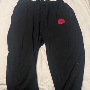 Moncler Black Garment with Red Logo Patch